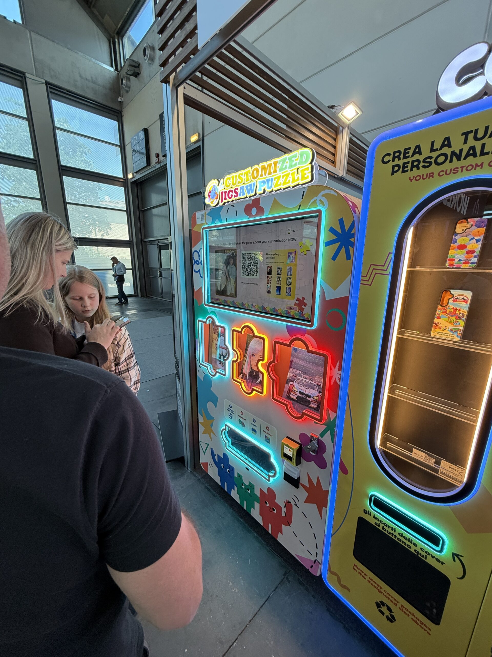 Personalisation machine screen showing QR code and photo selection