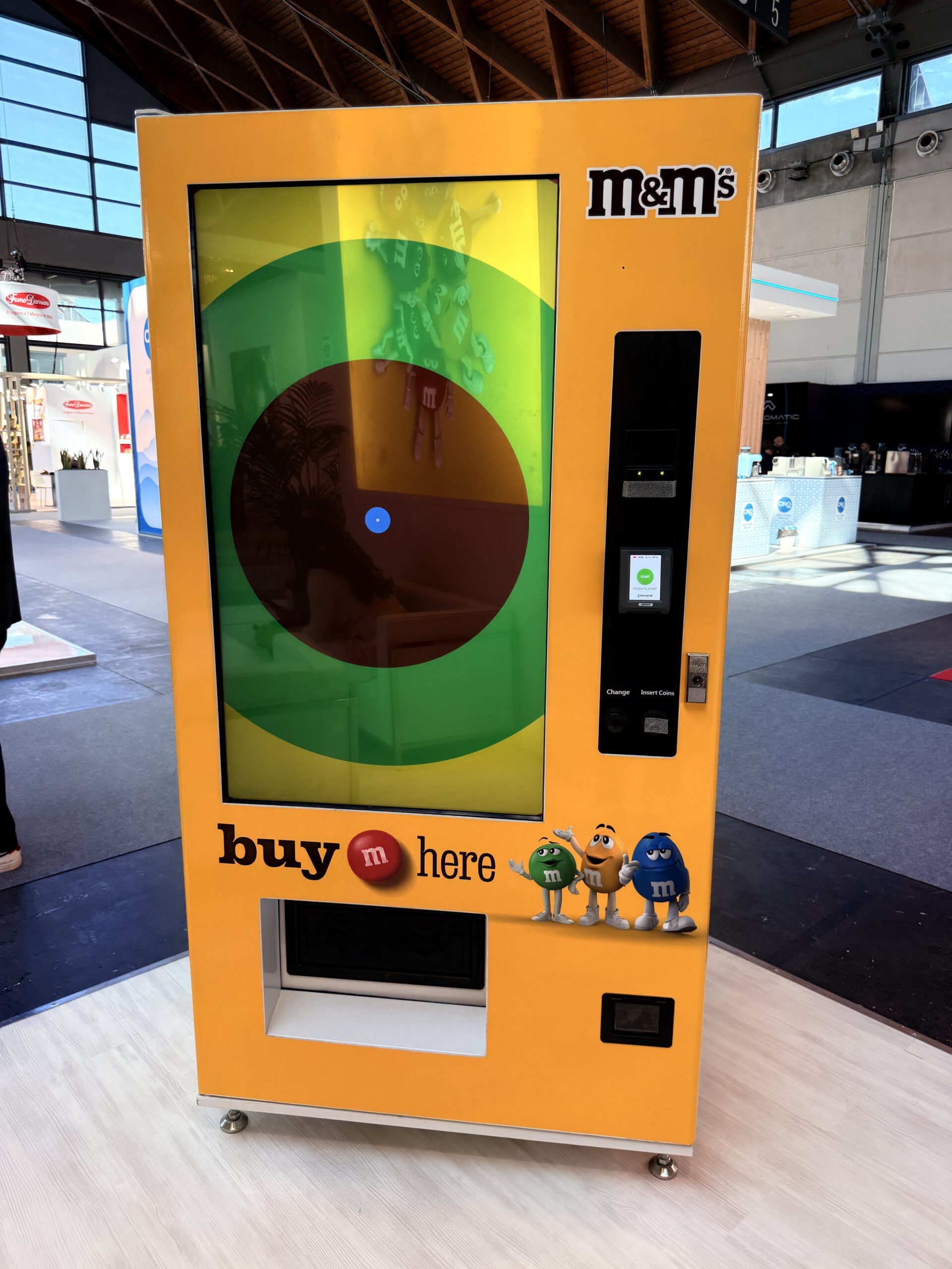 Fully branded vending machine with custom graphics in a public venue