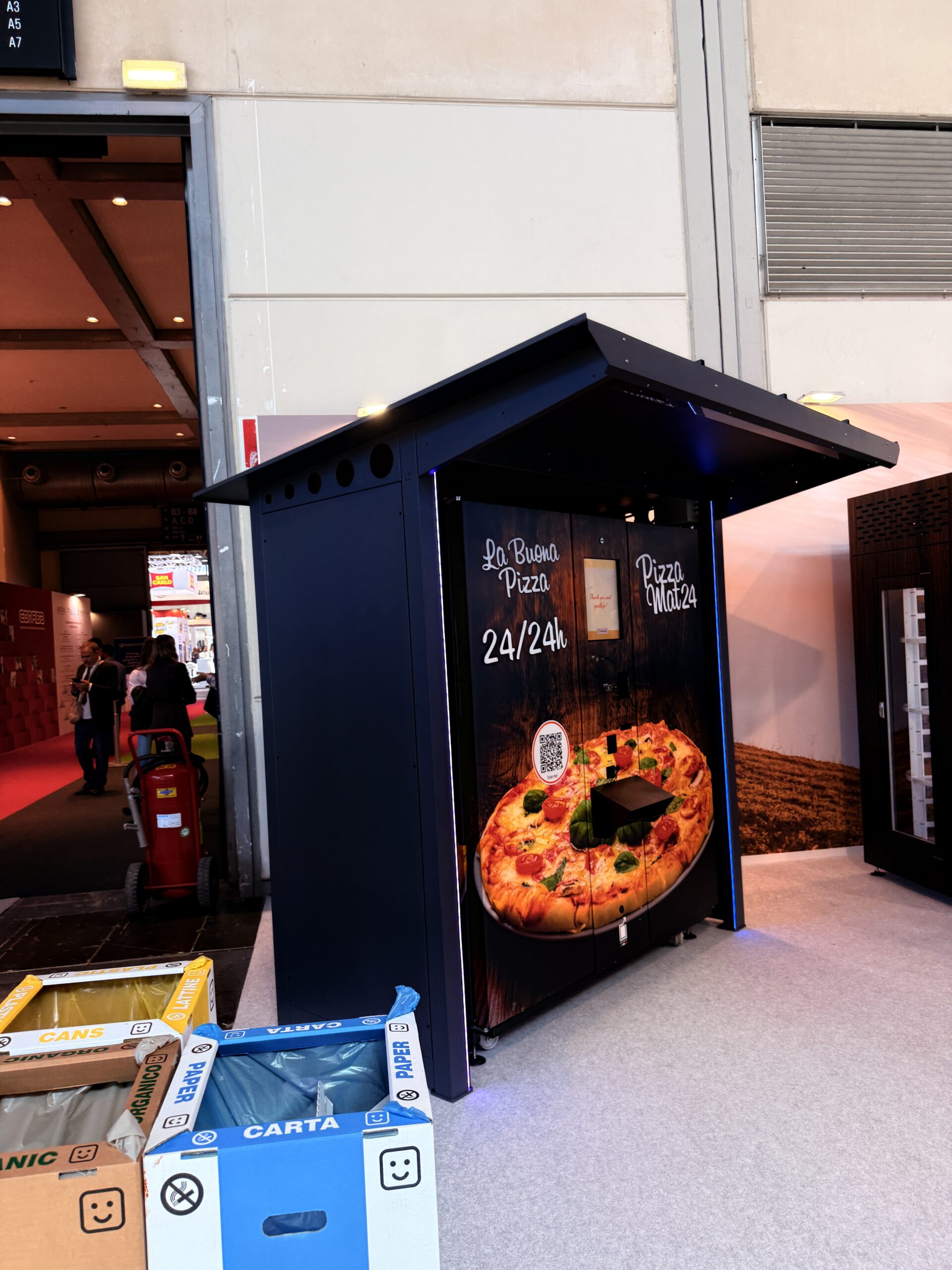 Outdoor pizza vending machine on a forecourt