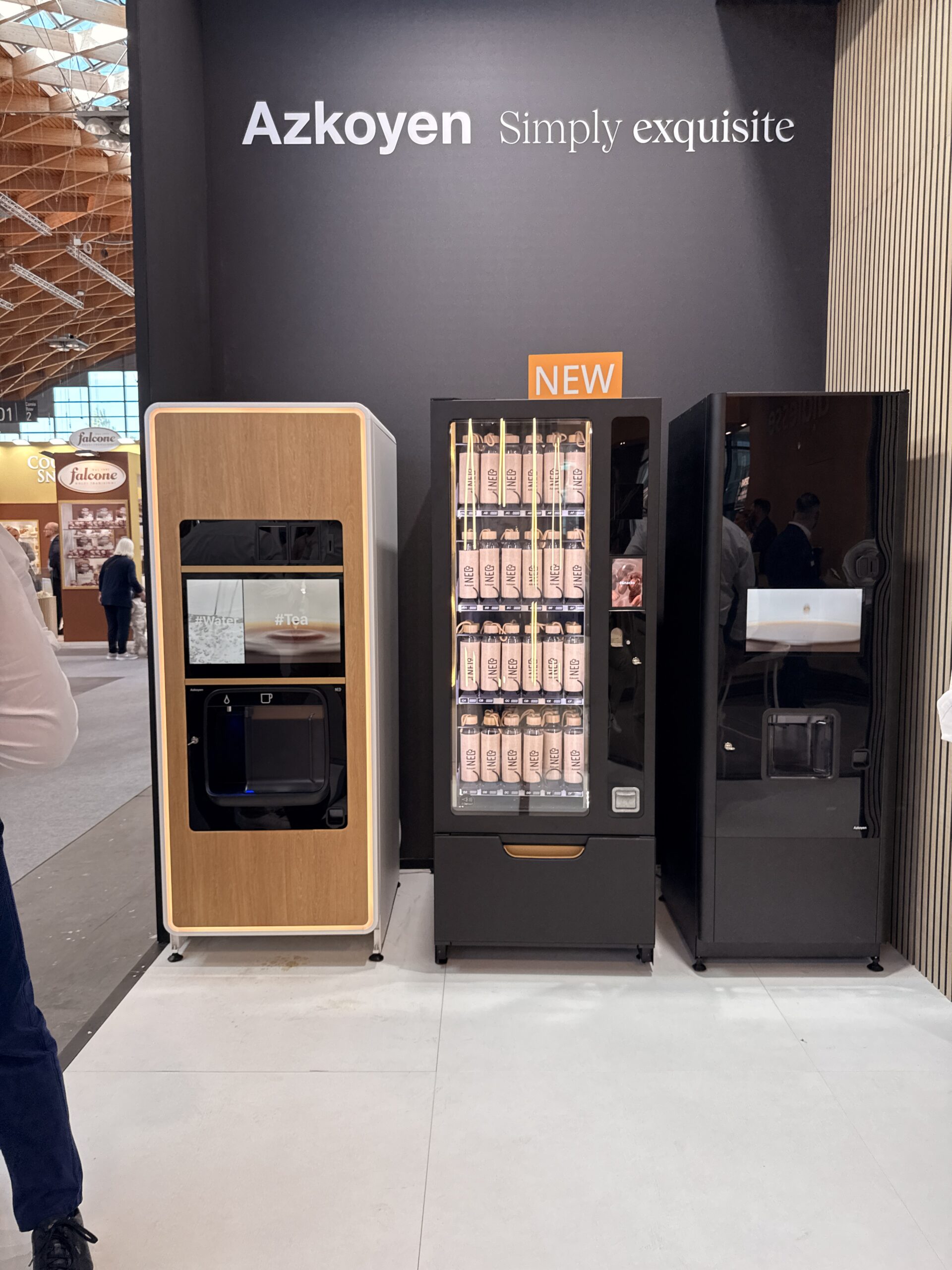 Tea vending machine with a wood finish showing tea and water options